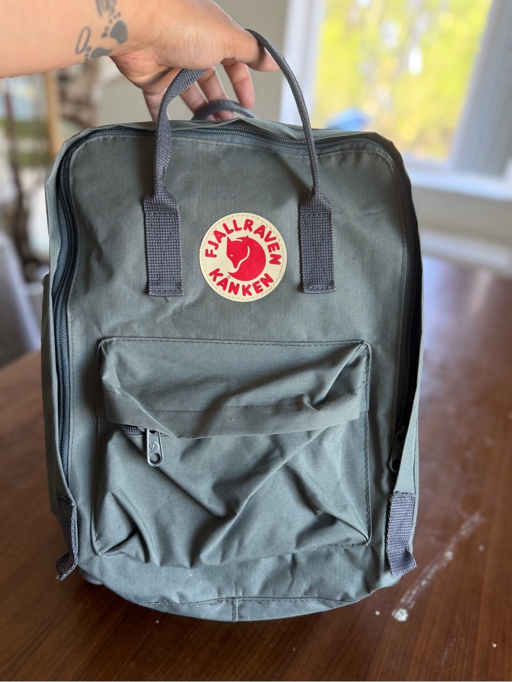 Fjallraven Kånken Backpack in Olive Green with Red Logo